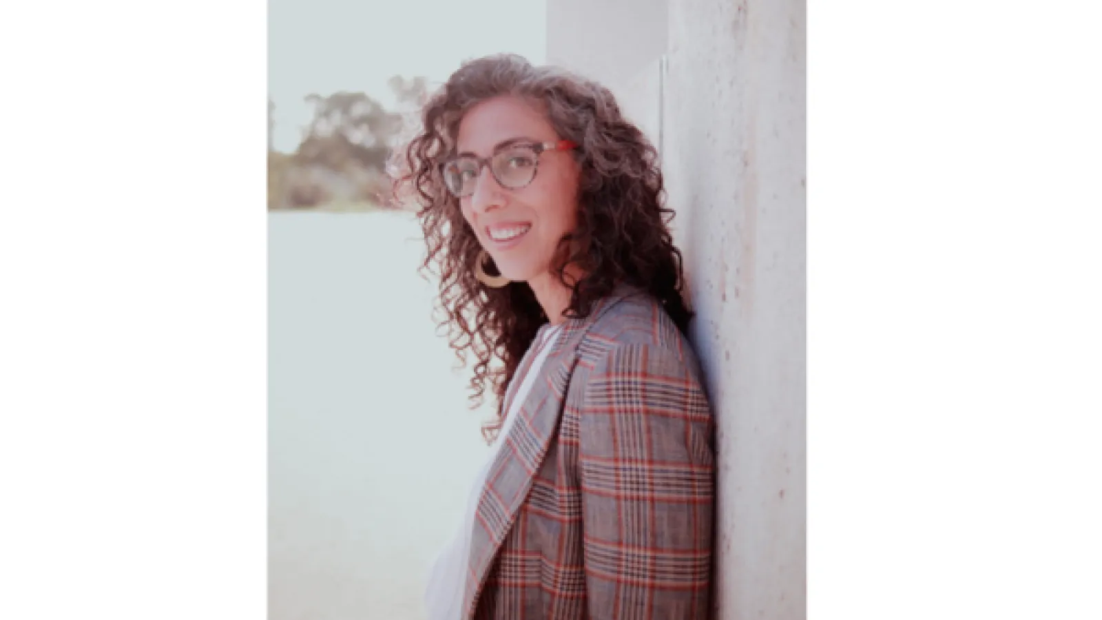 Ayelet Tsabari Profile Photo, leaning against a wall