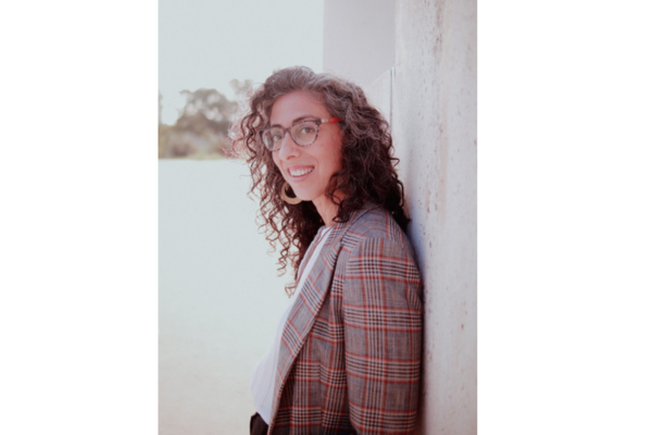 Ayelet Tsabari Profile Photo, leaning against a wall
